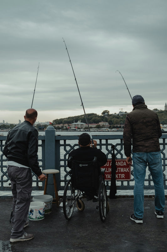 Three people fishing in a lake