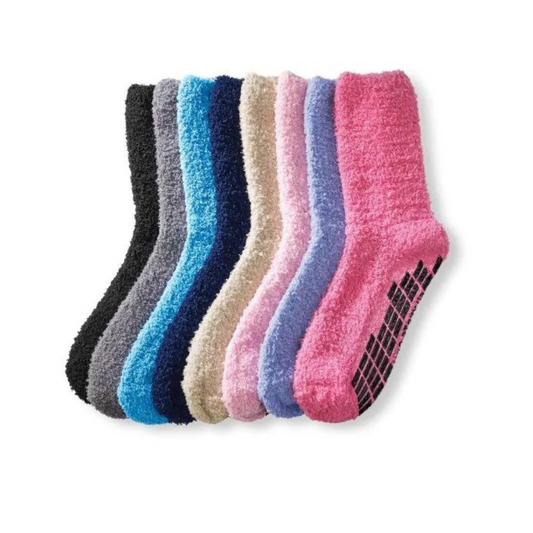 Multy color fuzzy socks, positioned to show the texture and non-slip grips on the soles